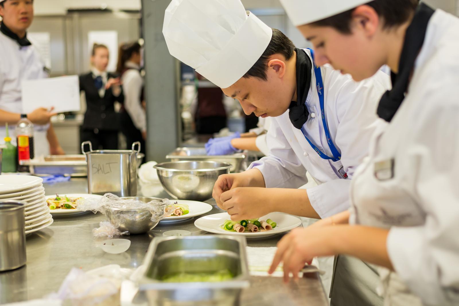 Culinary students preparing meal