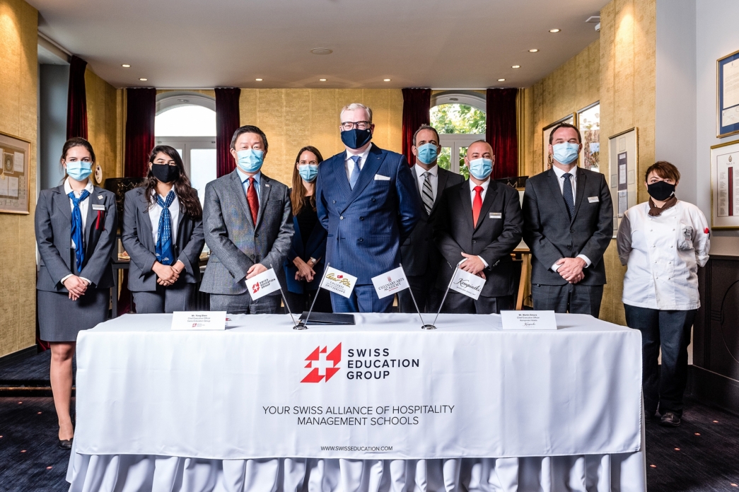 MM Yong Shen, Swiss Education Group's CEO and Martin R. Smura, Kempinski Hotels's CEO, signing the new partnership between SEG and Kempinski