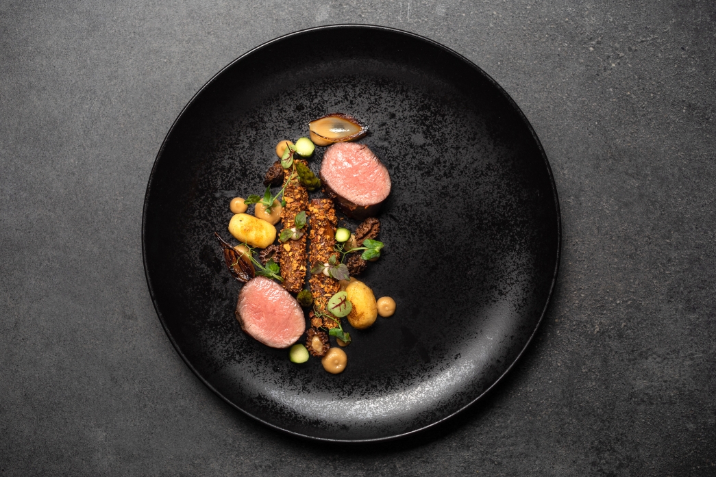 Lamb loin with roasted salsify, gnocchi and lamb jus 